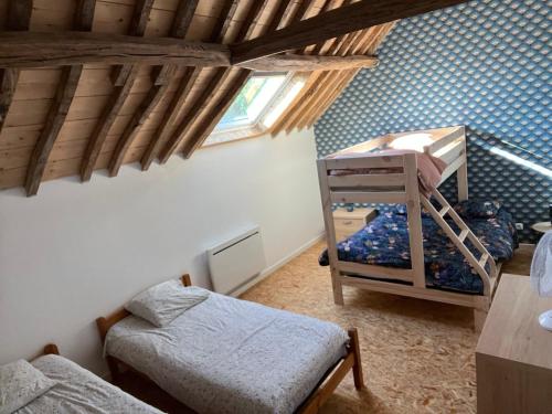 a bedroom with a bunk bed and a bunk bed at Le domaine de l'Ebenne in Englefontaine