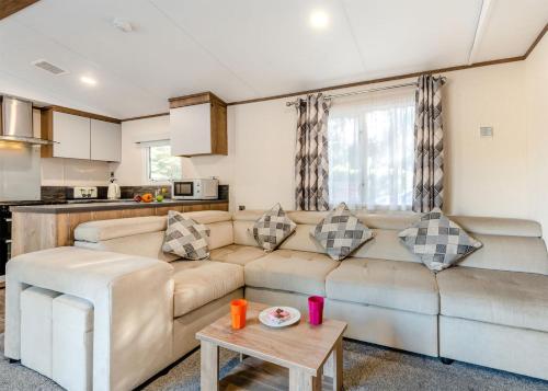 a living room with a couch and a table at Lower Hyde in Shanklin
