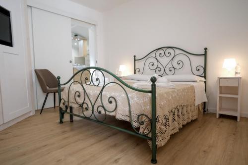 a bedroom with a bed and a chair in it at Terrazza con vista in Nicosia