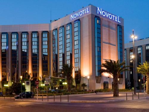 a large building with a sign on top of it at Novotel Nice Centre Vieux Nice in Nice