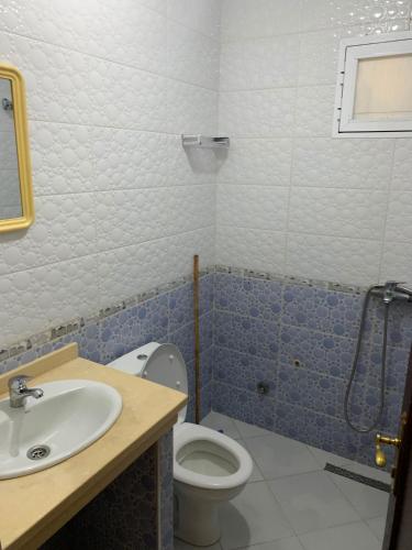 a bathroom with a toilet and a sink at maison avec jardin in Cabo Negro