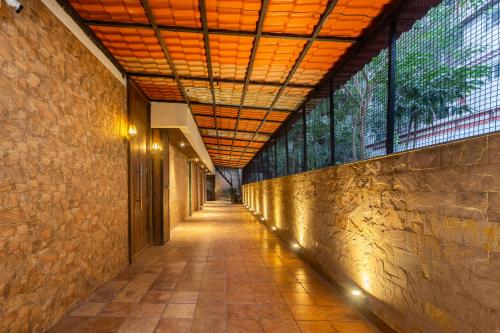an empty hallway of a building with a ceiling at MG Villa - A Boutique Stay in Navi Mumbai