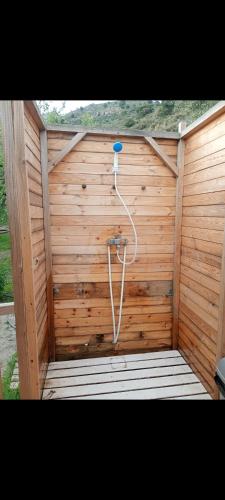 a wooden sauna with a blue ball in it at Private caravan with mountain and sea view in Guájar-Faragüit