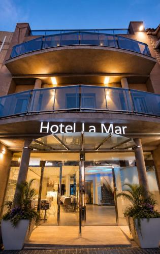 a hotel sign on the front of a building at Hotel Boutique La Mar - Adults Only in Peniscola