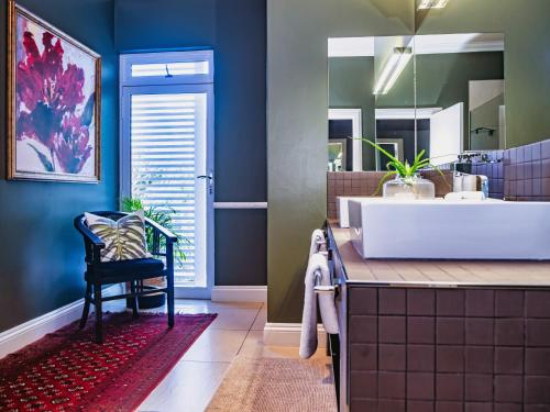 a bathroom with a large tub and a sink at Palmtree Luxury Villa Eden Rock Estate, Pennington in Pennington