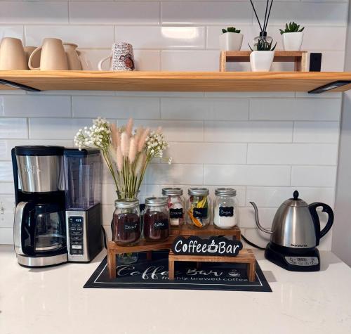 a coffee bar sitting on top of a kitchen counter at Downtown WS bungalow Close to Everything in Winston-Salem