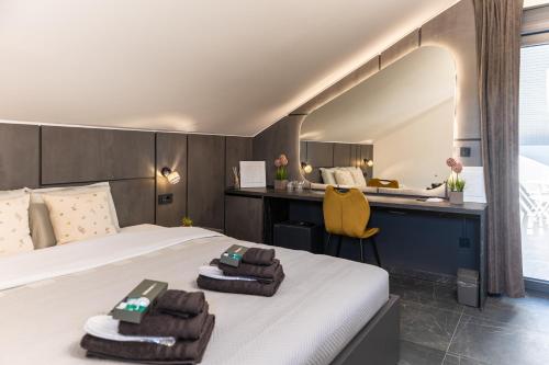 a hotel room with a bed and a desk at Villa Novara Holiday Home in Lužan Biškupečki