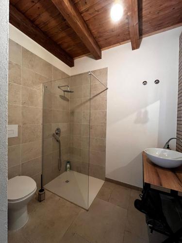 a bathroom with a shower and a toilet and a sink at PEACE ROOMS in Pozzallo