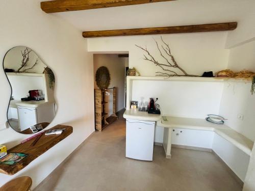 a bathroom with a sink and a mirror at Hotel marmaras in Neos Marmaras