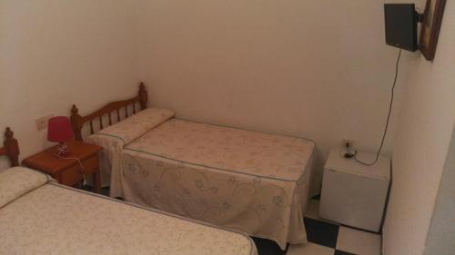 Cama o camas de una habitación en Pension Pinzapa