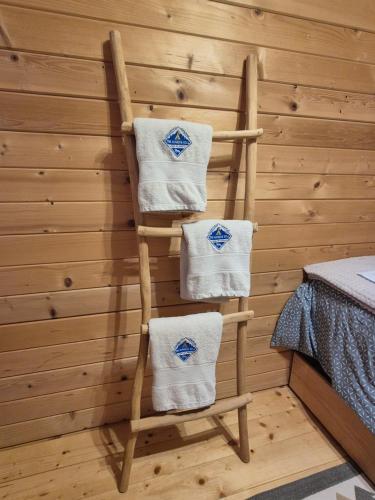 a wooden ladder with towels on it in a room at Camp The sunrise hill in Pivka