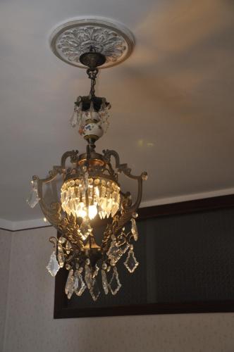 a chandelier is hanging from a ceiling at Nonna Rosa's Apartment in Pisticci