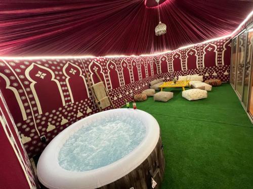 a room with a bath tub in a tent at Wow Hotel Dakhla Gym, Free Jacuzzi & Breakfast Included in Dakhla