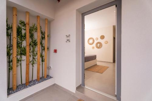 a hallway with a door leading into a room at IOSIF hideaway in Neos Marmaras