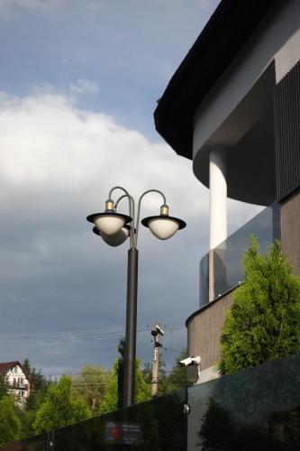 a street light in front of a building at Casa Braneana in Bran