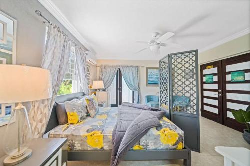a bedroom with a bed and a desk at Hidden Gem The Serenity - by ZenBreak in Christ Church