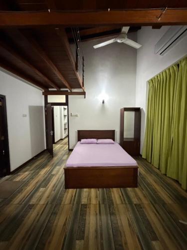 a bedroom with a bed in the middle of the room at Eldorado Apartments F2P3 Wattala in Alwis Town