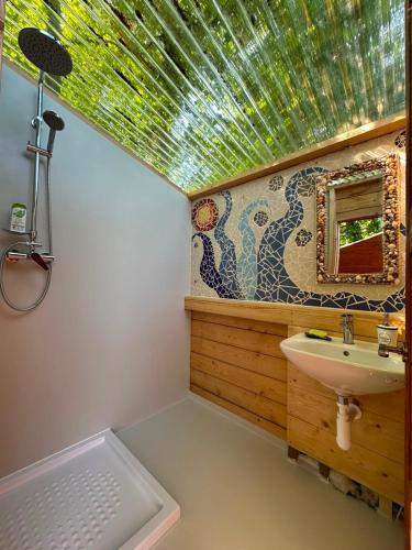 a bathroom with a sink and a mirror at Martinická jurta in Martinice u Dolních Kralovic