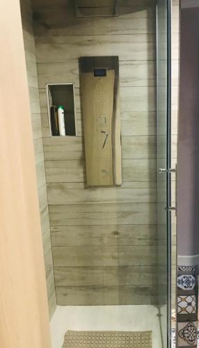 a shower with a glass door in a bathroom at CASA Di ANNA 2 in Terracina