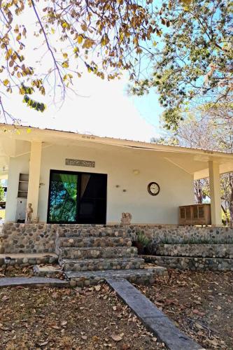 a building with a stone staircase in front of it at Amazing Grace Panamá in Boca Chica