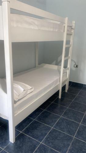 a couple of bunk beds in a room at First American Inn in Borsh