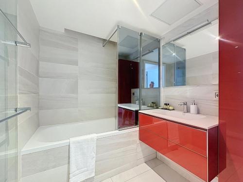 a bathroom with a tub and a sink and a shower at 7 Croisette in Cannes