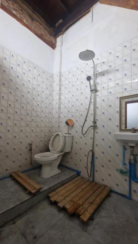 a shower in a bathroom with a toilet and a sink at Thai Traditional Home in Bangkok