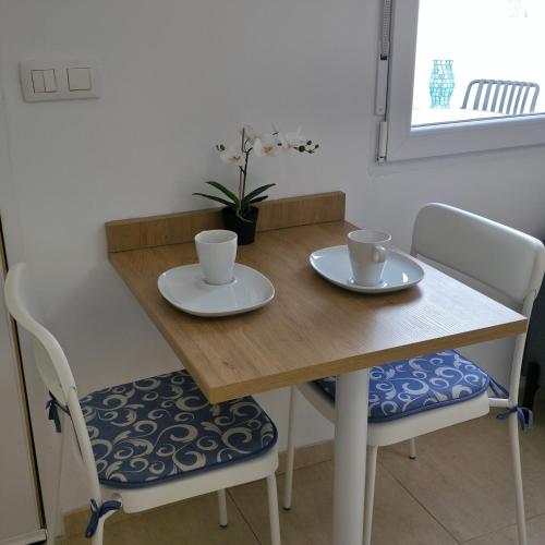 Modern Studio with Sunny Terrace - Steps from the Beach