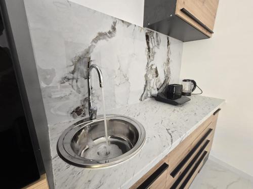 a kitchen with a sink in a counter at Smiljana 36 in Klimno