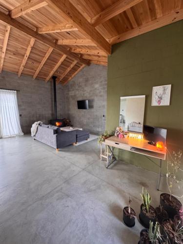 a large living room with a couch and a table at Entre Paz y Enfoque in Luján