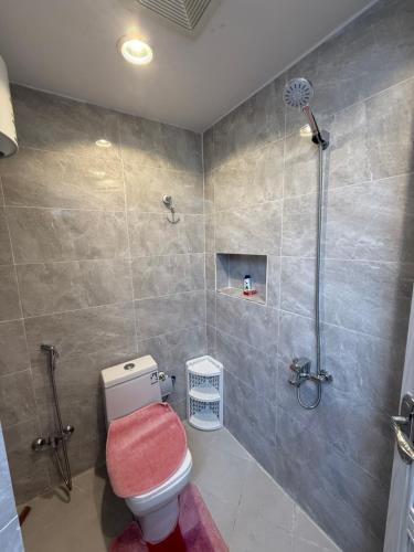 a bathroom with a shower and a toilet at ستديو in Al Baha
