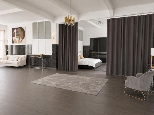 a bedroom with a bed and a living room at White House Meerane - Loft Sky in Meerane