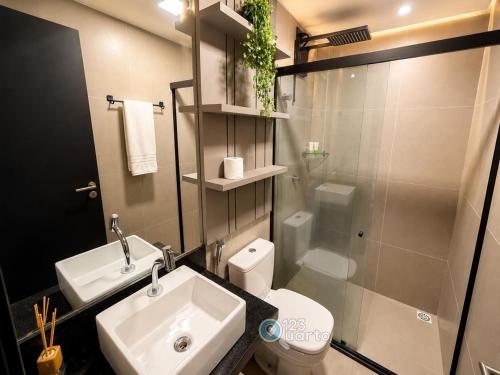 a bathroom with a sink and a toilet and a shower at Emunah by 123Quarto in Camalaú
