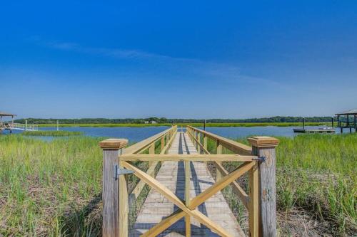 a wooden bridge over a body of water at The Toasted Oyster in Edisto Island