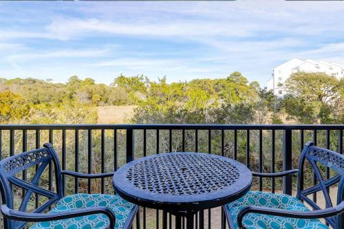 a table and two chairs sitting on a balcony at HH Beach & Tennis 226C in Hilton Head Island