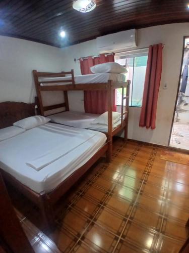 a bedroom with two bunk beds in a boat at Pousadas JC 1 AP completo in Santarém