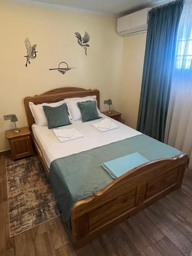 a bedroom with a large bed in a room at Souvenir in Isaccea