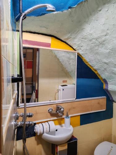 a bathroom with a sink and a mirror at Inspiration room - Toć in Split
