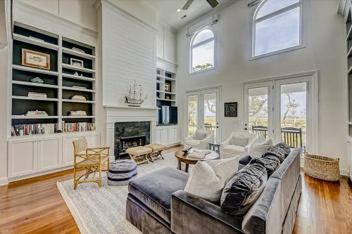 a living room with a couch and a fireplace at Luna Sea in Edisto Beach