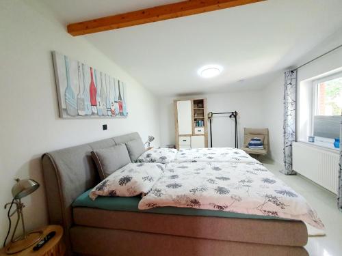 a bedroom with a bed and a window at Zeit für uns in Cuxhaven