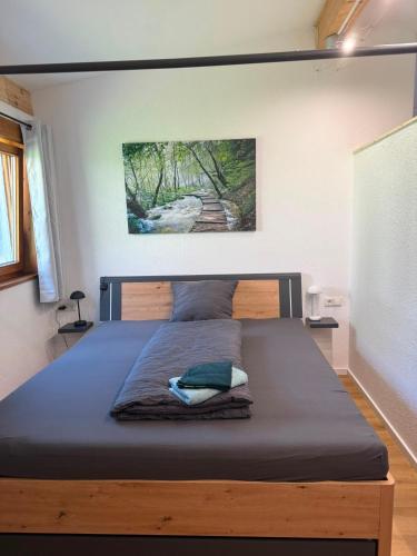 a bedroom with a large bed with a wooden frame at Apartment inn Austria in Pfunds