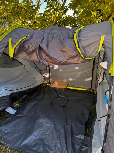 a tent sitting on the ground in the grass at Pey camp in Saubion