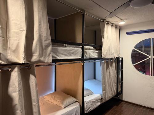 a group of bunk beds in a room at Hostal Vibes in Oaxaca City