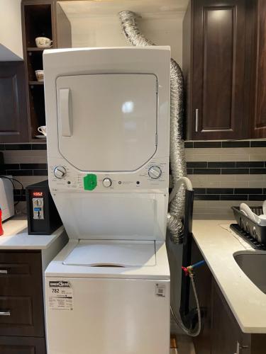 a white machine sitting on top of a kitchen counter at Glaive Home in Toronto