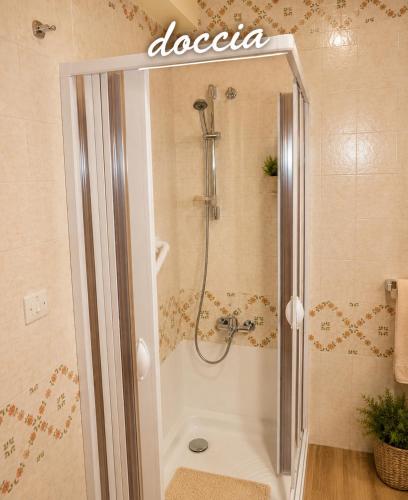 a bathroom with a shower with a tub and a shower at RESIDENCE ALTAIR Via Roma 13 in Ovindoli