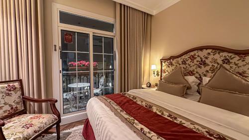 a hotel room with a bed and a window at The Classic Palace in Abha