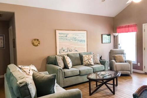 a living room with a couch and a table at Morillo's Miracle in Edisto Beach