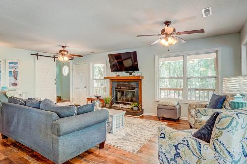a living room with two couches and a fireplace at In Spite of Ourselves in Edisto Beach