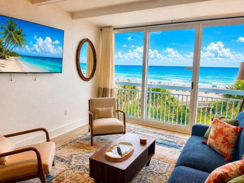 a living room with a view of the ocean at Renovated Oceanfront 1BR by Skywheel Yachtsman 400 in Myrtle Beach