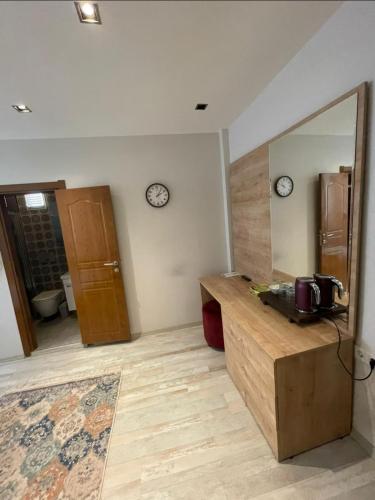 a room with a counter with a mirror and a door at Buhara 93 House - Sultanahmet in Istanbul